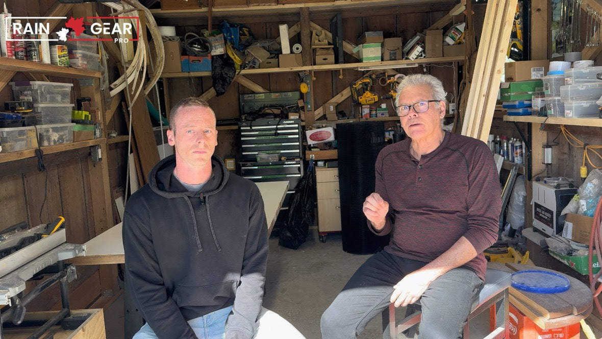 Two of Rain Gear Pro's founders in the shop workshop in British Columbia, tools and parts bins on the walls behind them